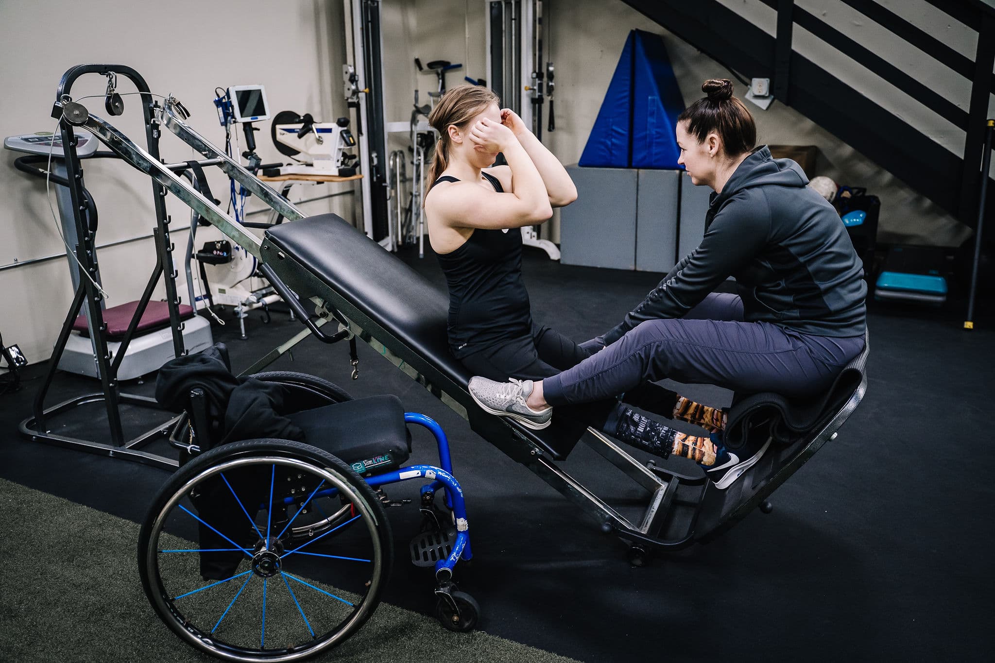 SCI client training on a recline trainer at ADAPT Advanced
