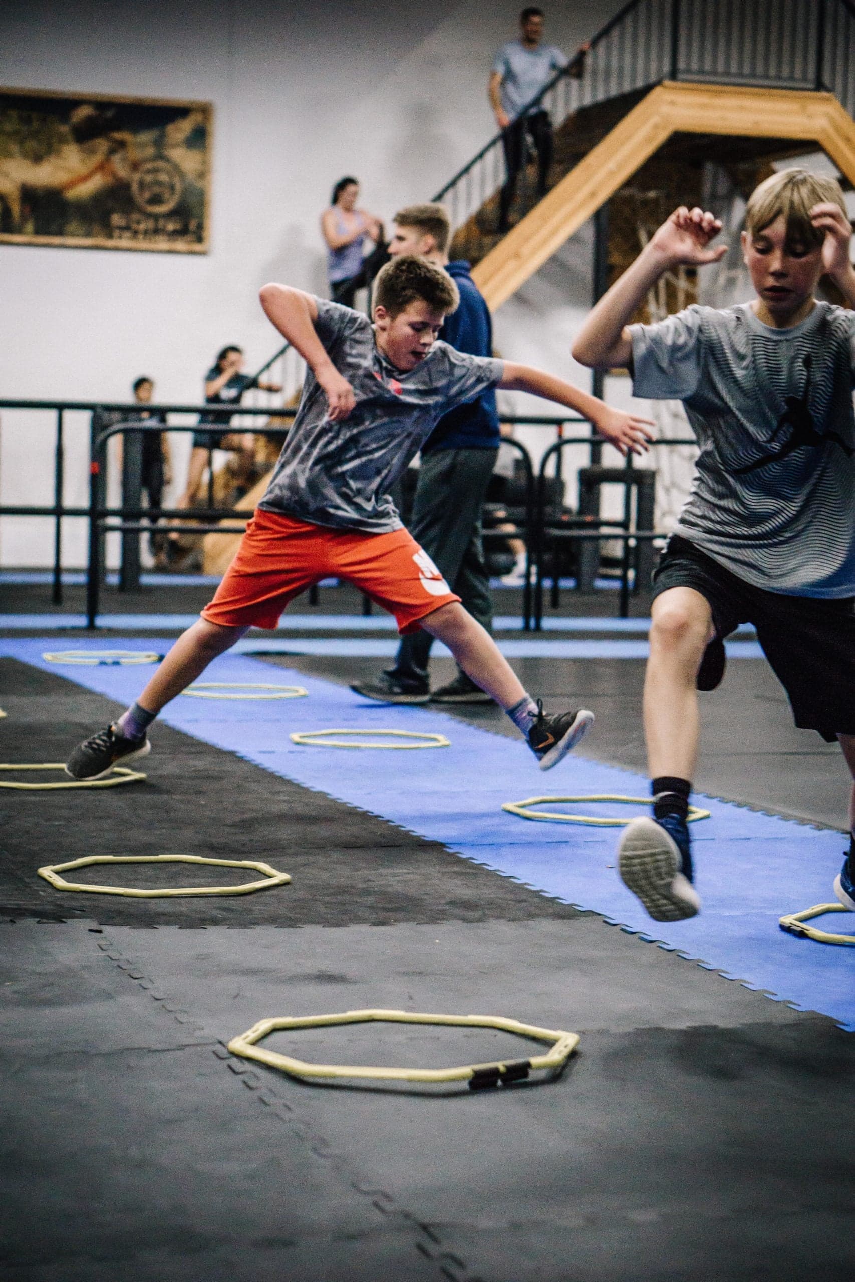 Youth athletes performing agility ring drills at ADAPT